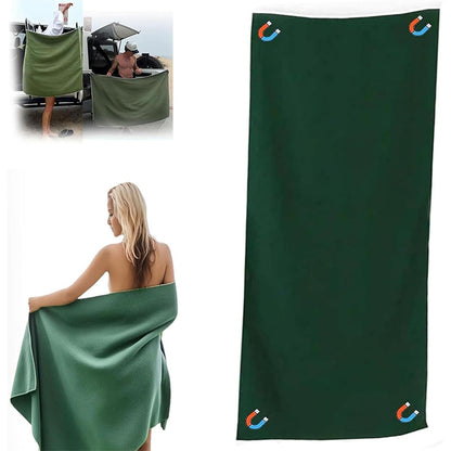Green towel with brand logo, used by a woman and displayed on a white background